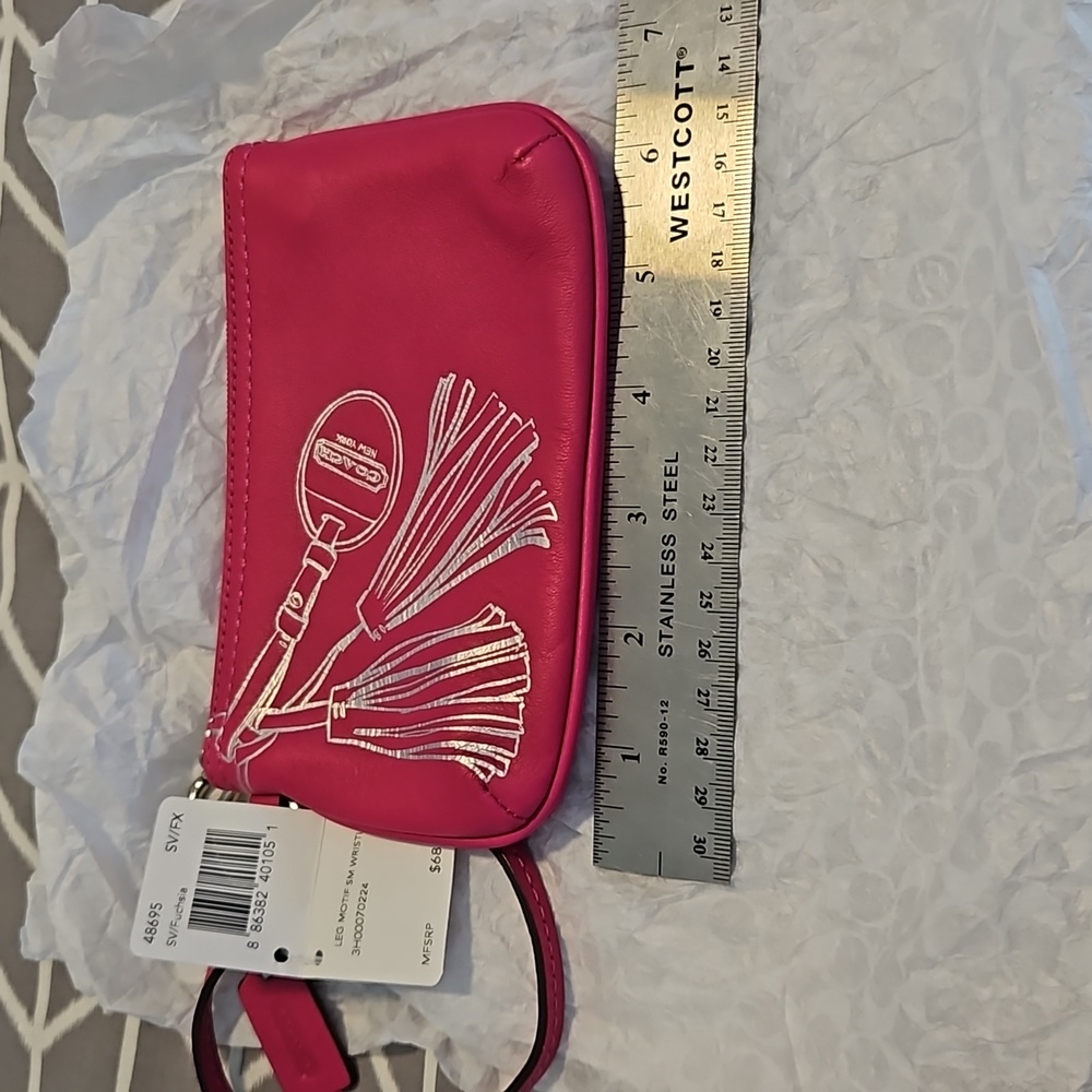 Coach Legacy Leather small wristlet in Fuchsia with silver hardware. NWT